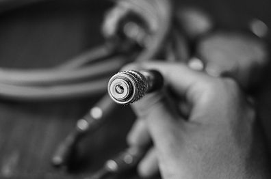 a refridgeration mechanic fixing a machine