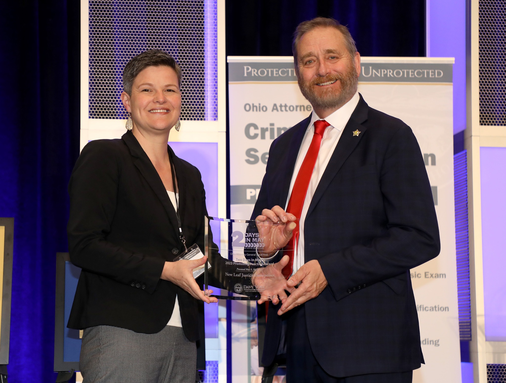 Jen Seifert Accepting Award from Ohio Attorney General David Yost