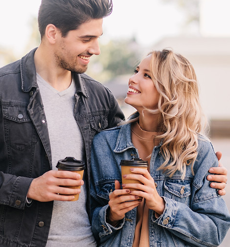 appealing-girl-looking-boyfriend-during-date-outdoor-portrait-couple-drinking-coffee (1).j