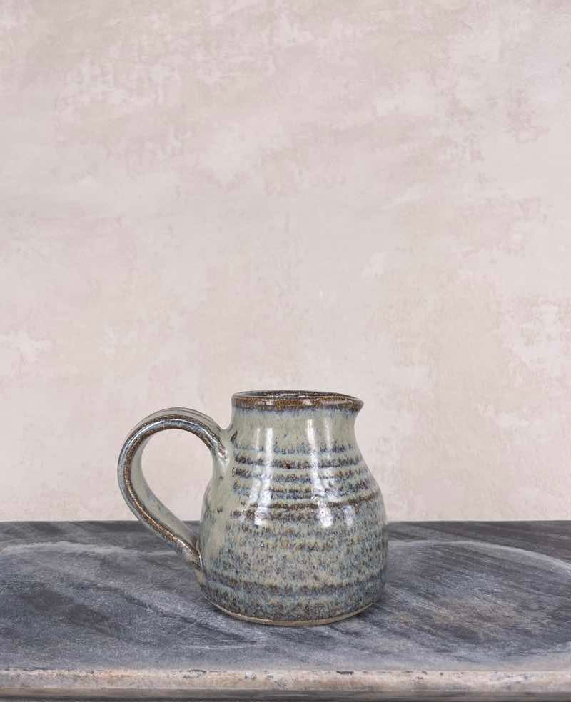 Vintage Artisan crafted studio pottery jug in blue brown textured glaze finish. C.1960's Mid century rustic decor