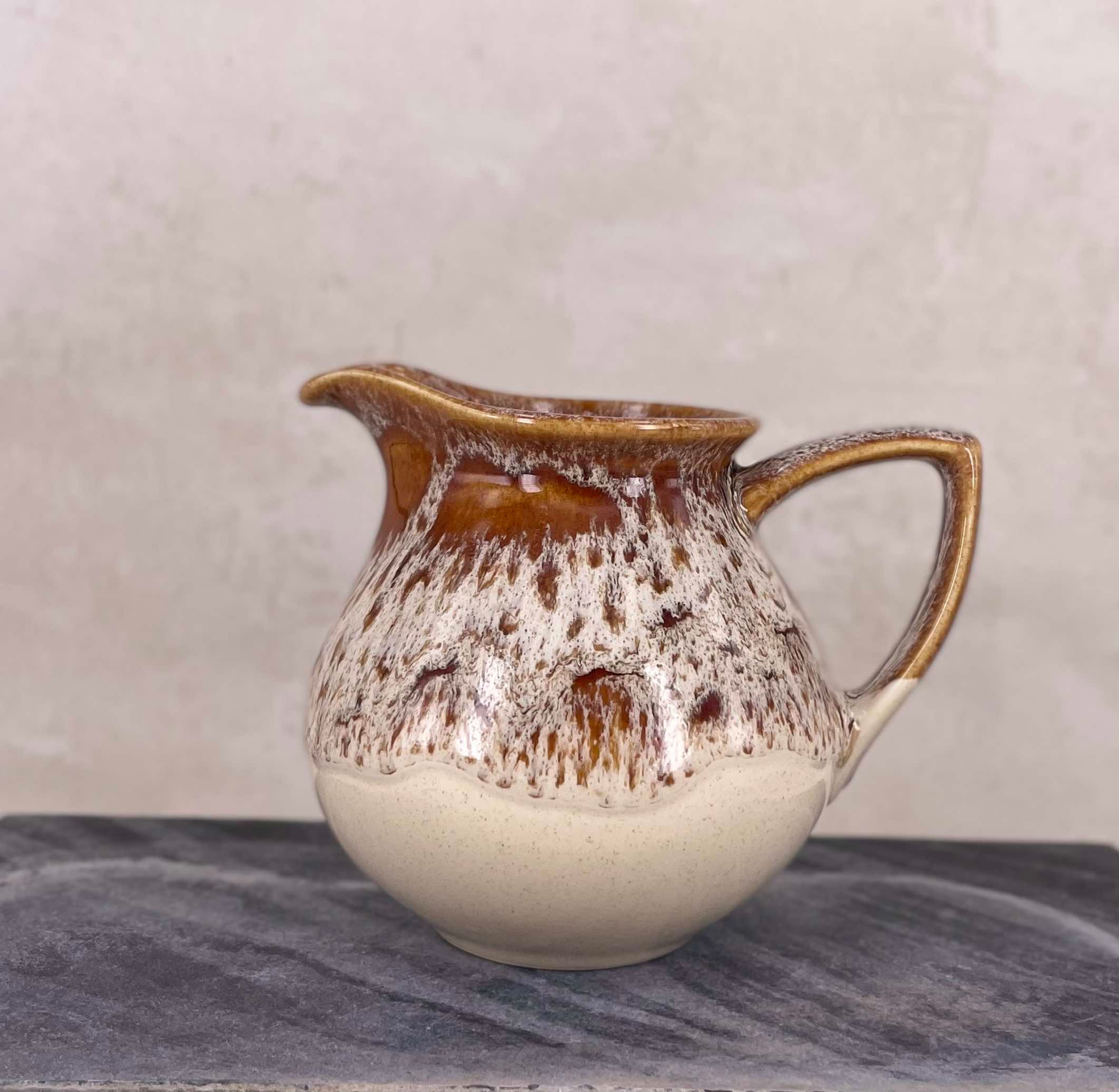 vintage Fosters Pottery jug, with the signature honeycomb drip glaze, stamped mid century large brown cream studio jug.