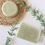 Miniature : rectangle and round green soaps with basket weave placemat and rosemary sprigs