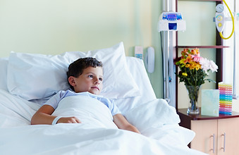 Child In Hospital Bed