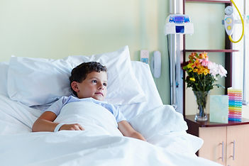 Child In Hospital Bed