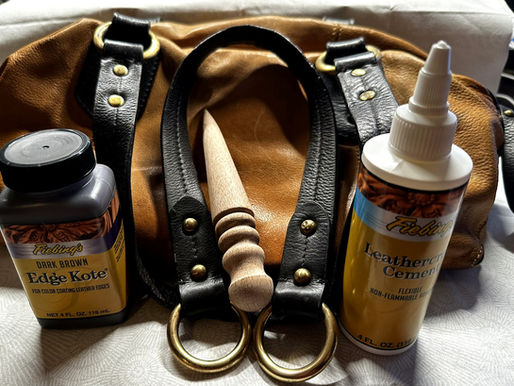 Brown Lucky brand leather purse with Fiebing's Dark Brown Edge Kote, Leathercraft Cement, and a wooden edge burnisher used to repair the cracked handle edging