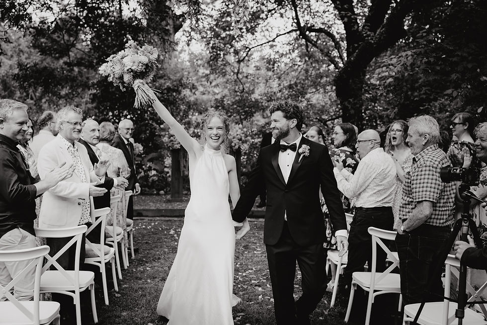 Happy Couple walking down the isle after their wedding ceremony at Bay of Plenty Wedding Venue, Old Forest School - Photographed by Rose Minnee Photography