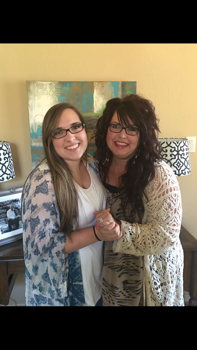 Shelley and Taylor pose in their living room