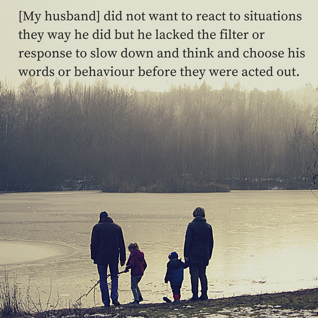 Photo of a family standing at a beach during winter