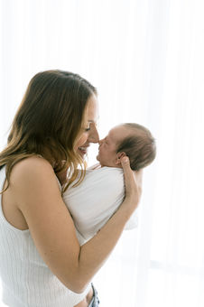 mother and baby noses touching during timeless newborn session