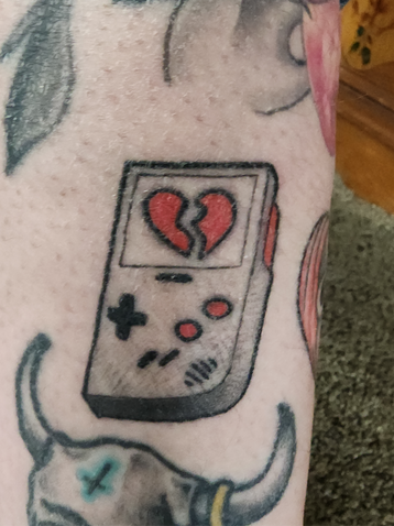 Black and Gray gameboy flash tattoo by Calcium Tattoo in Eureka, California