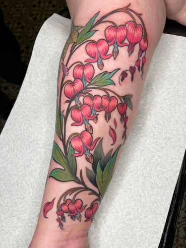 Neo-traditional floral quarter sleeve tattoo of bleeding hearts in color done at Sangha Tattoo Studio by Calcium Art Tattoo in Eureka, California.