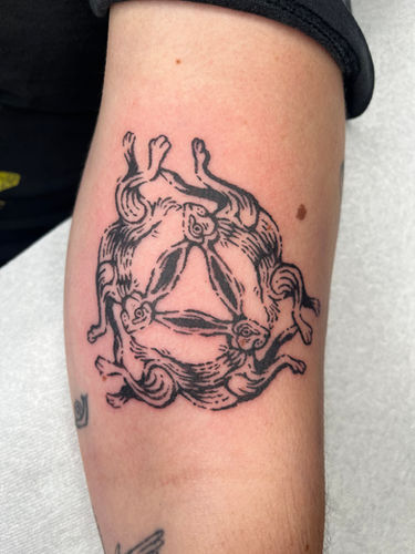 Three hares tattoo in linocut style done at Sangha Tattoo Studio by Calcium Art Tattoo in Eureka, California.