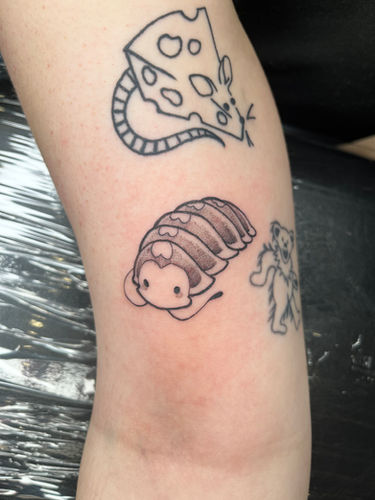 Roly Poly tattoo done at Sangha Tattoo Studio by Calcium Art Tattoo in Eureka, California.