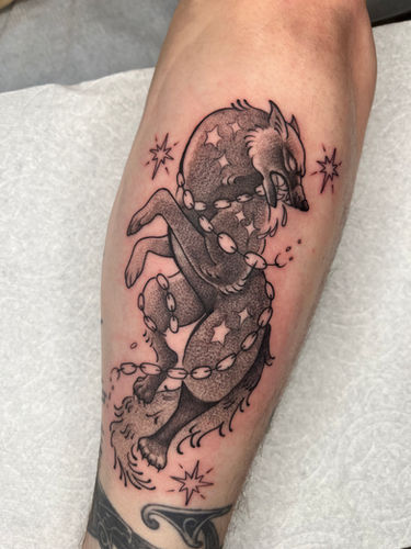Black and gray stipple shaded wolf tattoo done at Sangha Tattoo Studio by Calcium Art Tattoo in Eureka, California.