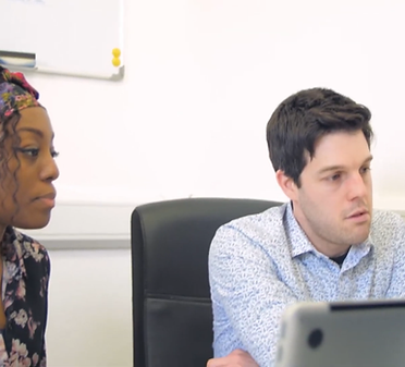 Oasis Care staff discussing employment options with a young person