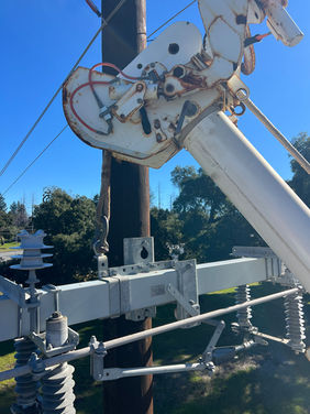 Industrial electrician performing utility transformer replacement and power system upgrades.