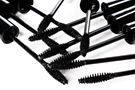 vecteezy_a-lot-of-black-mascara-wands-on-white-background_14352619_edited.jpg
