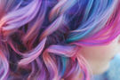 vecteezy_ai-generated-vibrant-multi-colored-hair-on-a-young-woman-in_41715578_edited.jpg