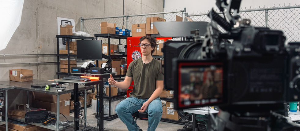 Videographer capturing behind-the-scenes footage during a production shoot