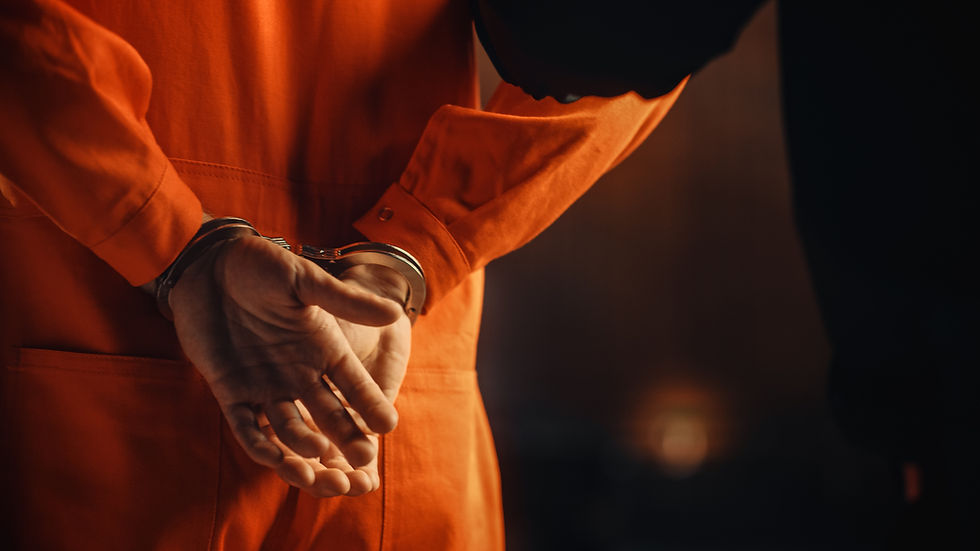 convicted inmate with hands in handcuffs behind their back