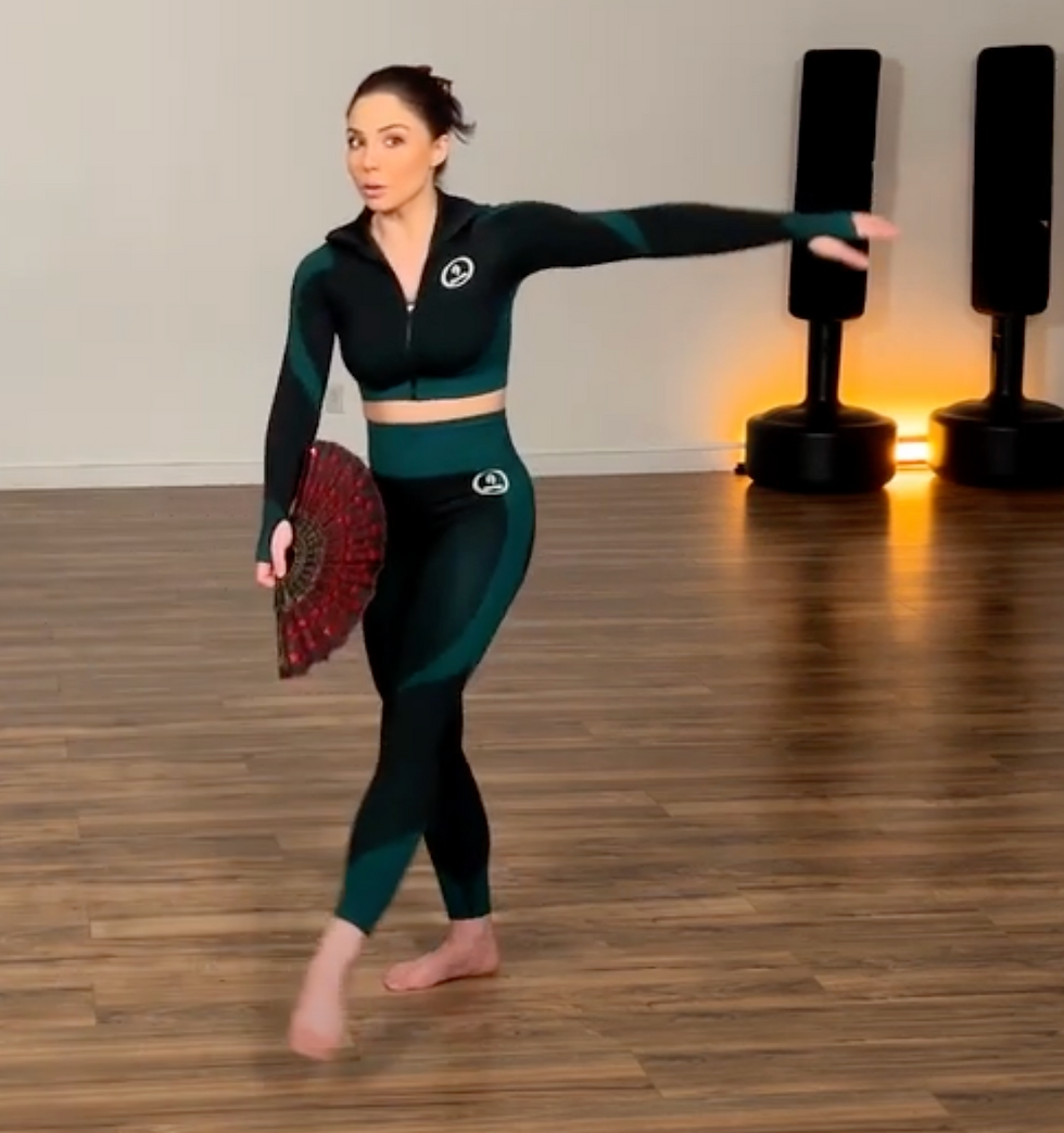 Personal trainer and functional aging specialist, Emma Mattison, guiding a client in dance choreography for fitness and well-being. Discover the joy and health benefits of dance. Book a free phone consult with Emma to enhance your fitness journey.