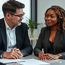 two people sitting at a desk. One is a mentor.jpg