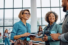 happy-entrepreneurs-communicating-while-attending-2023-11-27-05-01-20-utc.jpg