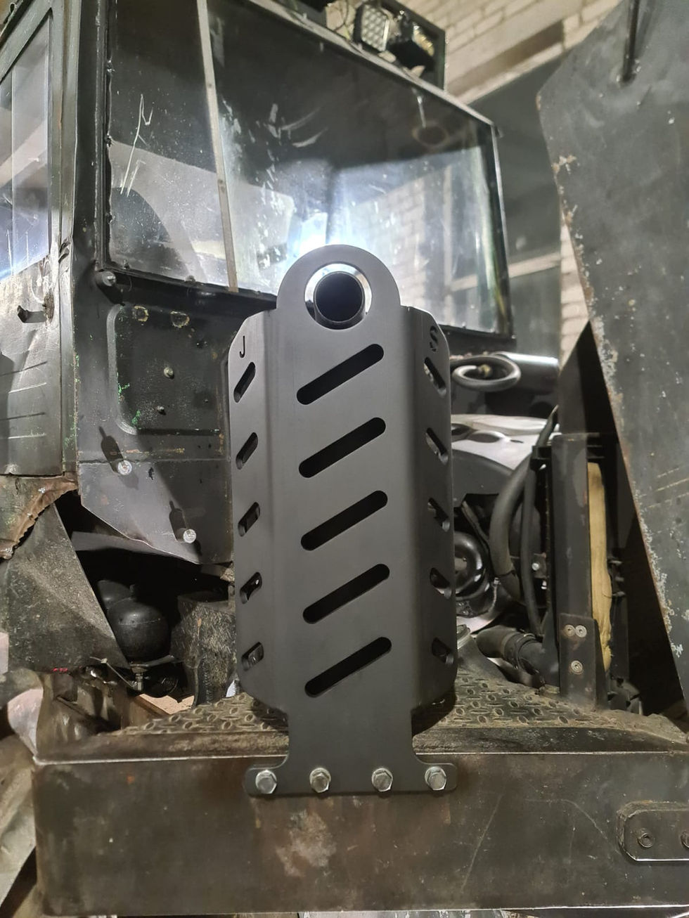 3D CAD model of a custom slotted exhaust guard