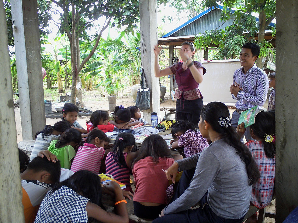Bren Journey praying over kids at LOHI