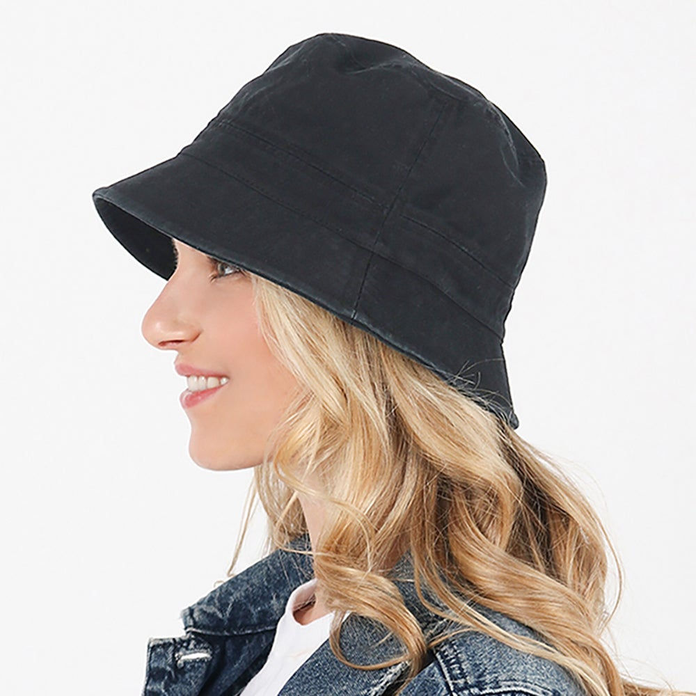 model wearing black satin lined bucket hat
