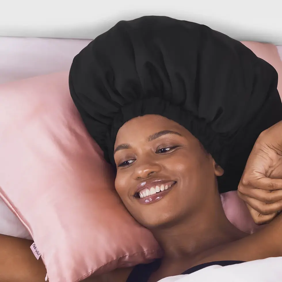 Model wearing Kitsch XL satin bonnet in black with curly hair tucked inside