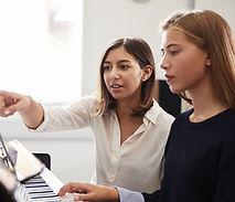 Piano teacher and student
