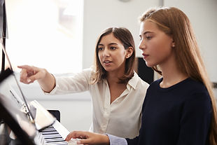 Teacher and Pupil at Piano Lesson