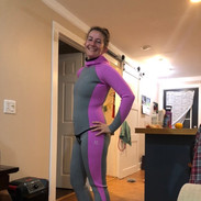 Woman indoors wearing a custom freediving suit