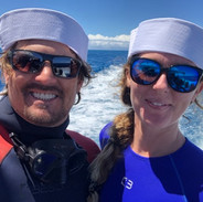 couple on a boat in custom freediving wetsuits