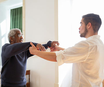 Physiotherapist carrying out home visit assessment in Cardiff