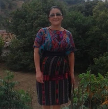 Mayan Weaver from Guatemala stands in traditional traje