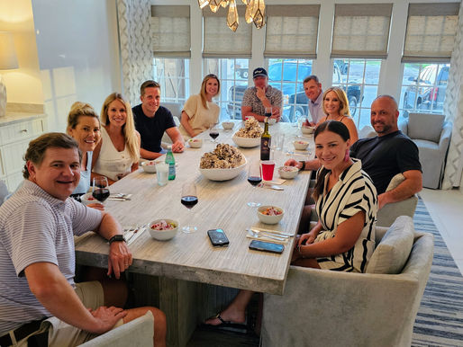 guests around the table at a private dinner in their home