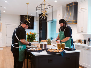 Chefs Richard & Chris preparing a meal in a home kitchen