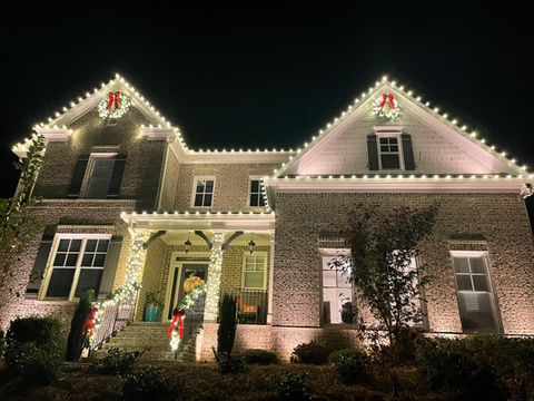 Residential Christmas light installation with warm white lights in Kennesaw, GA