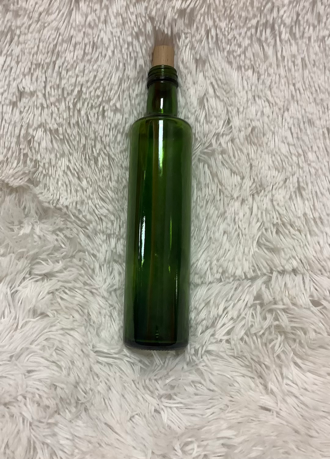 Straight side dark green bottle