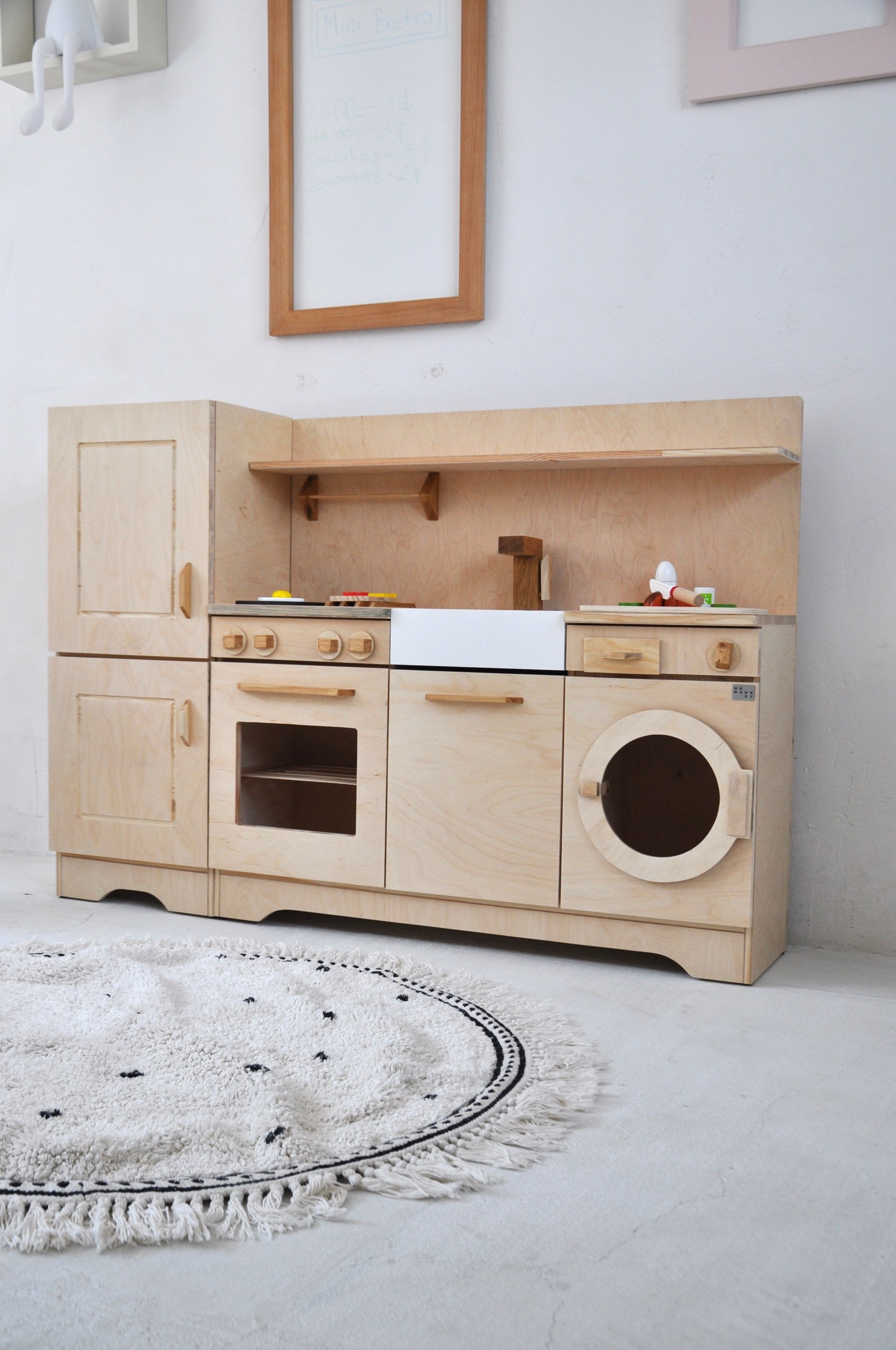 Wooden children's kitchen with a refrigerator, oven and Montessori dishwasher