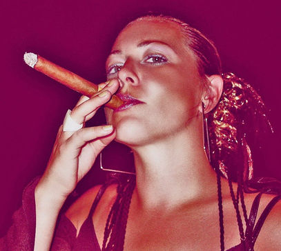 Young woman smoking a cigar in Cuba.