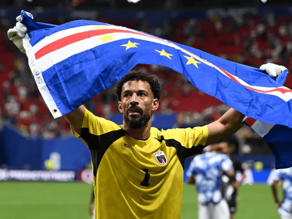 World Cup goalkeeper save shown on screen during live match in Ubud
