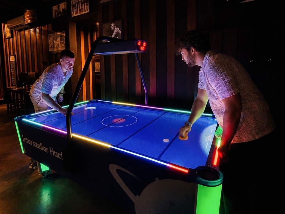 Air hockey table in the game room at The Melting Pot Saloon in Ubud