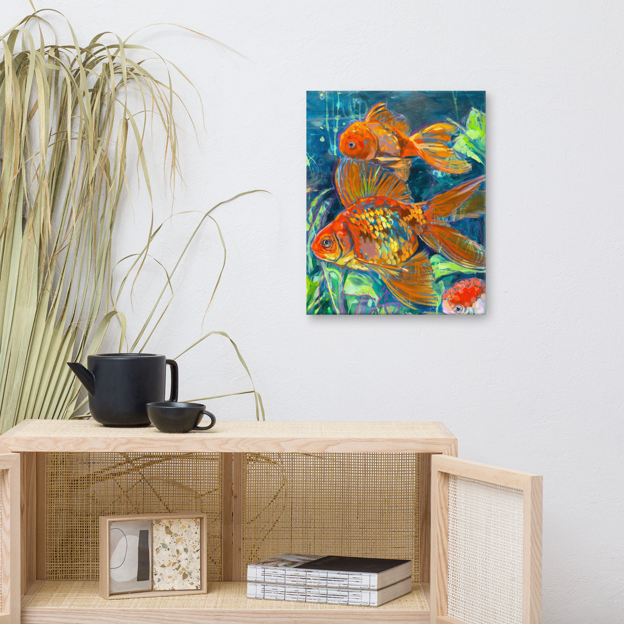 Canvas reproduction of two goldfish artwork on a wall above a cabinet