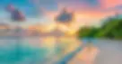 vecteezy_tropical-beach-with-vibrant-sunset-sky_46409864 v2.webp