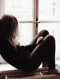 Woman Sitting Thoughtfully