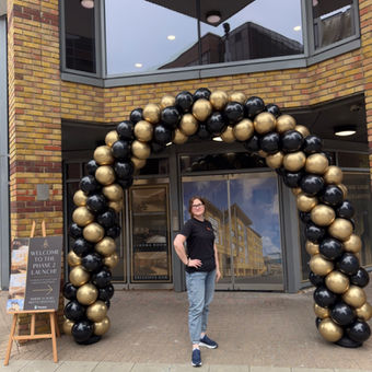 Black and gold classic balloon arch, installed in Woking town centre by confetti party, balloon company based in Guildford