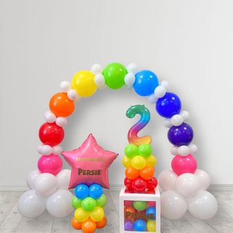 Colourful table balloon arch for a kid's birthday party. It was created and delivered by Confetti Party, a balloon decoration company based in Guildford.